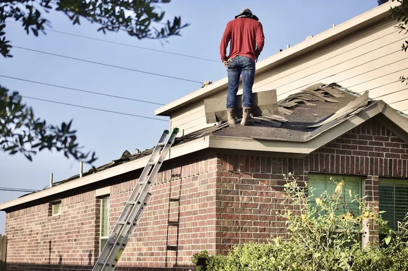 Professional roofer working on a residential roof in Majestic Ridge Estates